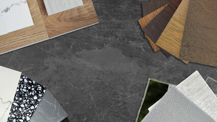 interior material samples including wooden laminated and vinyl flooring tiles swatch, marble stone quartz swatch, fabric draperies, ceramic tile placed on dark black marble stone. mood and tone board.