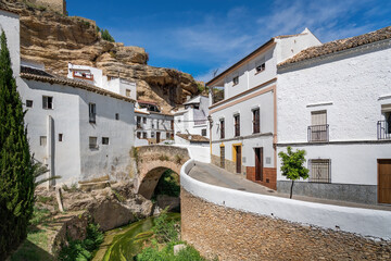 Fototapeta na wymiar Bridge over Trejo River and rock overhangs - Setenil de las Bodegas, Andalusia, Spain