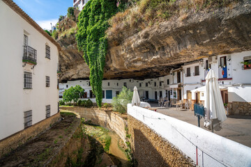Calle Cuevas del Sol Street with Rocks dwellings and restaurants - Setenil de las Bodegas, Andalusia, Spain © diegograndi