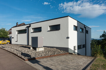 heat pump in a new building area with modern house facades