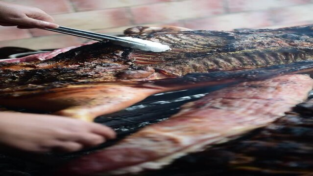 Argentinian grilled meat cooking - asado argentino (pork)