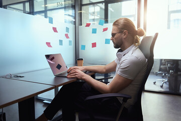 Guy with the laptop is located in the office box