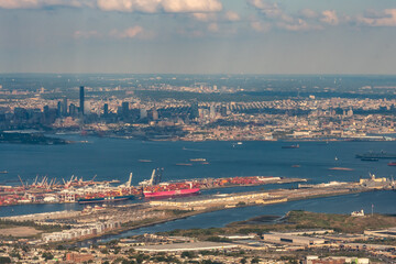 Aerial view of Shipping Containers, Newark Bay, Panamax cranes, and the Port of Newark - Elizabeth Marine Terminal run by the Port Authority of Newark and New Jersey