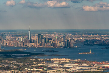 Aerial view of New York Harbor featuring the statue of liberty, Liberty Island, Ellis Island and...
