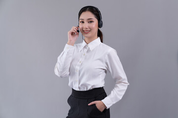 Attractive asian female call center operator with happy smile face advertises job opportunity on...
