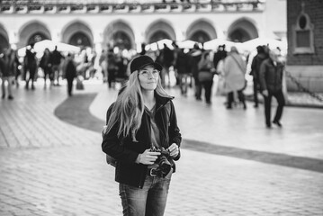 Young beautiful caucasian traveler woman with digital compact camera. Travel lifestyle, world travel explorer, tourism concept. World Photography Day