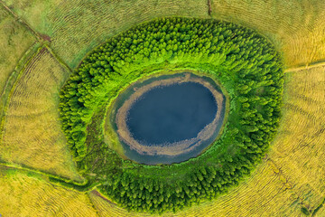 Aerial view of beautiful lagoon in the Azores islands. Drone landscape view with lines and textures in the background. Top view of volcanic crater, tourist attraction of Portugal.