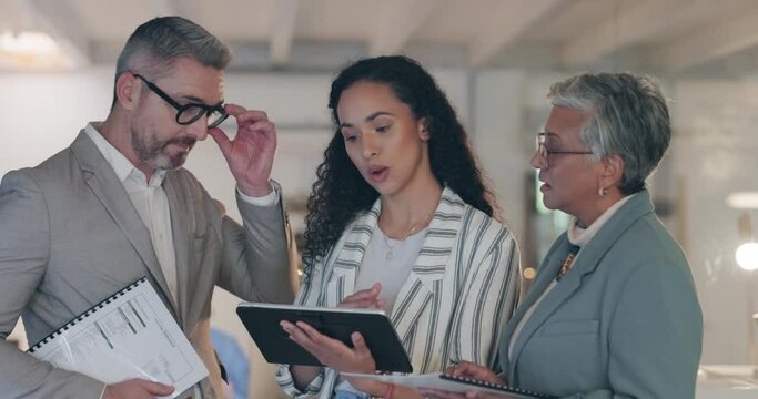 Business people, tablet and meeting for project strategy, teamwork or collaboration at the office. Group of employees in team discussion with technology for planning, proposal or ideas at workplace