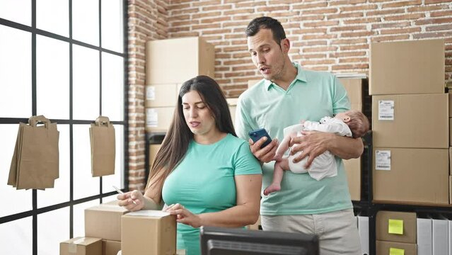 Family of three working at ecommerce business at office