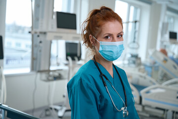 Portrait of female therapist in medical uniform in hospital