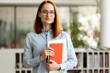 Portrait of successful middle aged businesswoman, manager looking at camera. Smart confident...