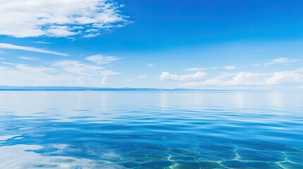 Obraz premium View of a tranquil water surface under an abstract blue sky.