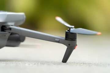 Closeup of motor and propeller of drone quadcopter for taking video and pictures. Preflight checking of before takeoff