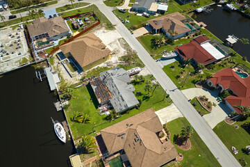 Destroyed by hurricane Ian suburban coastal houses in Florida home residential area. Consequences of natural disaster