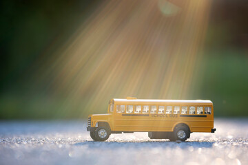 Toy american yellow school bus as symbol of education in the USA