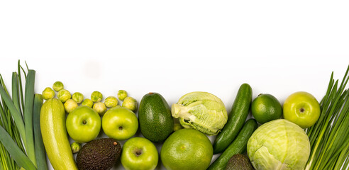 Panoramic set of ripe, juicy green color fruits and vegetables on white background with copy space. Avocado, apple, lime, cabbage, pomelo