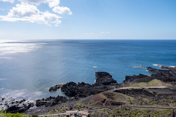 Aerial view of Ferraria with the Atlantic Ocean in Background. Thermal waters at Ponta da Ferraria, thermal waters in the sea and natural hot water pools. S&atilde;o Miguel island in Azores