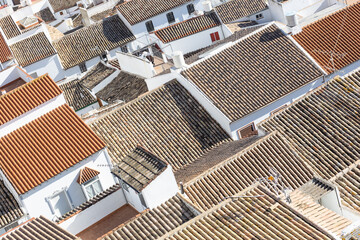 Aerial panoramic view of rooftops of white houses of Olvera town, considered the gate of white...