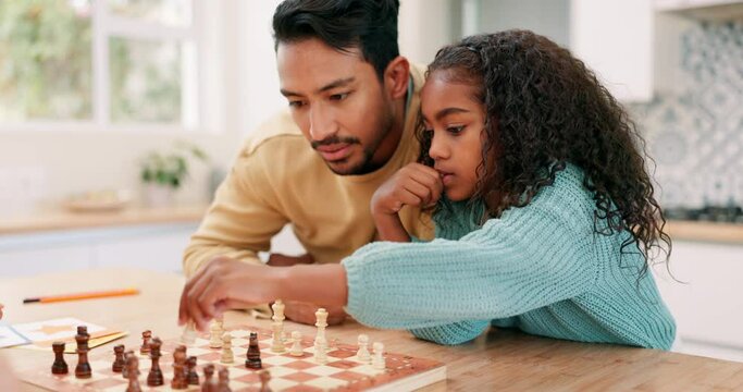 Family, father and child playing chess at home while teaching or learning board game. Multiracial man and kid partner together to play for fun, checkmate or competition for development and bonding