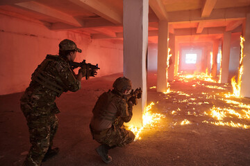  A group of professional soldiers bravely executes a dangerous rescue mission, surrounded by fire...