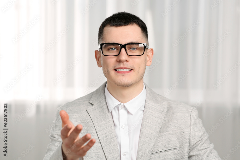 Poster Young man having online video call indoors, view from web camera