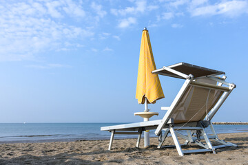 empty beach deckchair umbrella concept holiday silence