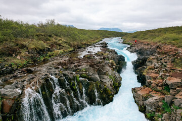 Naklejka na ściany i meble Aerial view of the beautiful Midfoss Waterfall in Iceland