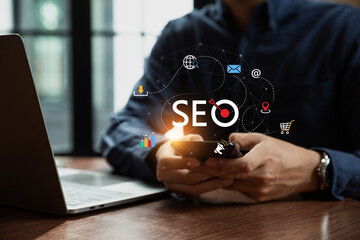 Businessman using phone for analysis SEO Search Engine Optimization. Digital marketing process,...