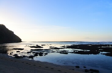 Fototapeta na wymiar Beautiful morning before sunrise at Gunung Payung beach, Bali, Indonesia.