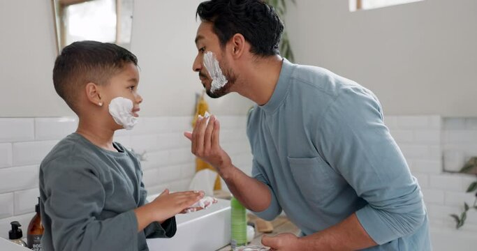 Learning about shaving cream, kid and dad teaching skincare in family bathroom with son in the morning. Boy, helping with grooming beard, beauty or shave with funny parent with happy child in home