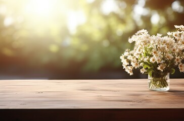 Vase with daisies on wooden table in front of blurred background.