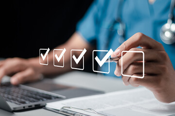 Doctor fills out the medical survey paperwork and checking mark on checkboxes.