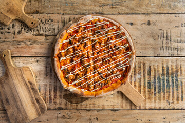 Delicious sliced pizza on wooden board
