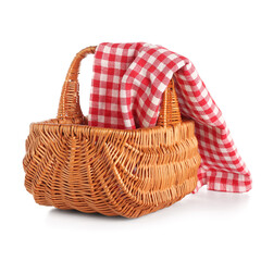 Wicker picnic basket with red checkered napkin isolated on white background
