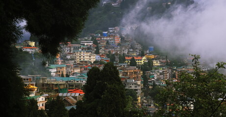 panoramic view of misty and cloudy darjeeling hill station and himalaya mountain foothills in...