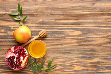 Composition with bowl of honey and ripe fruits on wooden background. Rosh hashanah (Jewish New Year) celebration