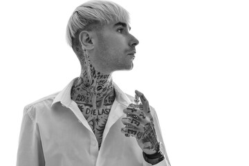Tattooed young man with perfume on white background