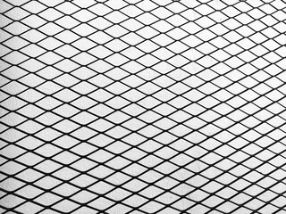 Metal mesh diamond grill background texture