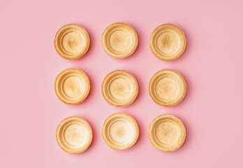 Homemade tartlets on pink background