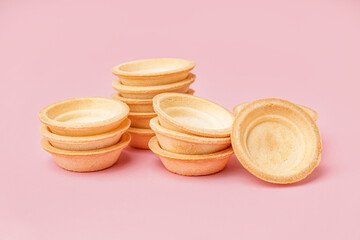 Homemade tartlets on pink background