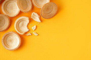 Homemade tartlets on yellow background
