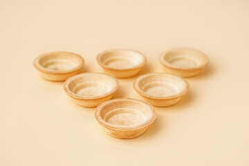 Homemade tartlets on yellow background
