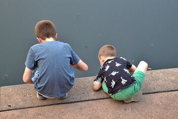 boys looking into water