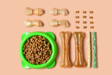 Composition with different dog treats on color background