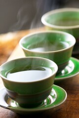  Serenity in Motion: Close-Up of Pouring Green Tea into a Cup, Captured in Exquisite 4K Resolution