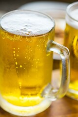 Refreshing Pour: Close-Up of Pouring and Serving Cold Beer into a Glass, Showcased in Crisp 4K Resolution