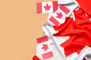 Flags of Canada on orange background