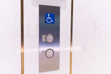 elevator botton for disabled person on the marble wall