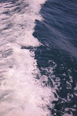 Sea water with waves and reflection in different light. Texture background for design.	