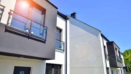 New single family houses in a new development area. Residential homes with modern facade. Terraced...